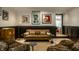 Inviting living room featuring designer couch, soft chairs, unique artwork, and modern lighting at 410 Somerset W Dr, Indianapolis, IN 46260