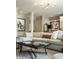 Comfortable living space featuring modern decor, built-in shelves, and a stylish area rug at 410 Somerset W Dr, Indianapolis, IN 46260