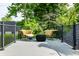 Outdoor patio with wicker chairs and gray deck at 410 Somerset W Dr, Indianapolis, IN 46260