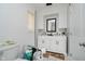 Bathroom featuring a dual sink vanity, black fixtures, and black framed mirror at 4232 Linden Ln, Anderson, IN 46011