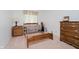 Bedroom featuring wooden bed frame, dresser, and window, ready for your personal touch at 4232 Linden Ln, Anderson, IN 46011