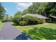 A beautiful driveway with mature landscaping enhancing the curb appeal at 4232 Linden Ln, Anderson, IN 46011