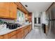 Cozy kitchen featuring wooden cabinets, modern appliances, and a window view, perfect for home cooking at 4232 Linden Ln, Anderson, IN 46011
