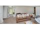 Well-lit living room with tile entry and access to the front door at 4232 Linden Ln, Anderson, IN 46011