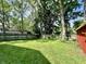 Beautiful lush backyard with green grass and a wooden fence at 4714 Crestview Ave, Indianapolis, IN 46205