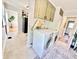 Tiled laundry room featuring a washer, dryer, and unique 