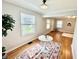 Bright living room featuring hardwood floors and a rug with circular details at 4714 Crestview Ave, Indianapolis, IN 46205