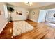Bright living room with beautiful hardwood floors, a modern rug, and neutral paint at 4714 Crestview Ave, Indianapolis, IN 46205