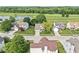 Aerial view of a residential neighborhood with well-manicured lawns and a nearby pond at 4818 Arabian Run, Indianapolis, IN 46228