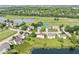 Aerial view of a neighborhood with a pond and a golf course nearby at 4818 Arabian Run, Indianapolis, IN 46228
