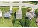This aerial view shows a well-maintained home with a spacious yard adjacent to a lush golf course at 4818 Arabian Run, Indianapolis, IN 46228