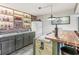 Charming bar with brick accents, custom lighting, sink, granite countertops, and a stylish wooden front at 4818 Arabian Run, Indianapolis, IN 46228