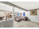 Finished basement featuring a leather sectional and a bar area with a fridge at 4818 Arabian Run, Indianapolis, IN 46228