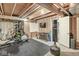 Finished basement area with exercise equipment, rubber flooring, and drywall partition walls ready for customization at 4818 Arabian Run, Indianapolis, IN 46228