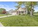 Charming single Gathering home showcasing manicured landscaping, mature trees and a long driveway at 4818 Arabian Run, Indianapolis, IN 46228