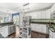 Modern kitchen featuring white cabinets, stainless steel appliances, and dark countertops at 4818 Arabian Run, Indianapolis, IN 46228
