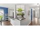 Open kitchen view with stainless steel appliances, granite countertops, and a hanging plant for added charm at 4818 Arabian Run, Indianapolis, IN 46228