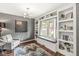 Cozy living room featuring built-in bookshelves, window seating, and neutral decor at 4818 Arabian Run, Indianapolis, IN 46228