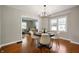 Inviting dining room with hardwood floors, neutral walls, and stylish furnishings at 5232 E 10Th St, Indianapolis, IN 46219