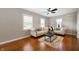 Bright living room with hardwood floors, neutral walls, stylish sofas, and ample natural light at 5232 E 10Th St, Indianapolis, IN 46219