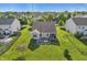 Aerial view of the house showcasing the backyard, patio, and neighborhood at 5560 Goodwin St, Indianapolis, IN 46234