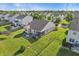 Aerial view of the house, backyard patio with furniture, and surrounding neighborhood at 5560 Goodwin St, Indianapolis, IN 46234