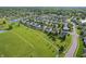 Aerial view of the community showcasing houses and large green common area at 5560 Goodwin St, Indianapolis, IN 46234