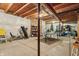 Unfinished basement space with exposed ceiling, concrete floor, and storage/recreation equipment at 5560 Goodwin St, Indianapolis, IN 46234