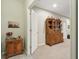 Basement hallway with carpet flooring, wood furnishings, and neutral-colored walls at 5560 Goodwin St, Indianapolis, IN 46234