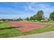 Outdoor basketball court with painted lines and hoops, set in a community recreation area at 5560 Goodwin St, Indianapolis, IN 46234
