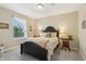 Comfortable bedroom with soft carpet, a window letting in natural light, and neutral walls at 5560 Goodwin St, Indianapolis, IN 46234