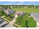Aerial view of the home with a well-manicured lawn, mature trees, and a view of the surrounding neighborhood at 5560 Goodwin St, Indianapolis, IN 46234