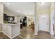 Open concept kitchen with an island, stainless appliances, and views to the front entrance at 5560 Goodwin St, Indianapolis, IN 46234