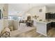 Open floor plan featuring the kitchen, dining area, and living room with vaulted ceilings at 5560 Goodwin St, Indianapolis, IN 46234