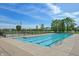Community pool featuring a lap-swimming area and a wading pool, all enclosed by a secure fence at 5560 Goodwin St, Indianapolis, IN 46234