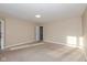 This bedroom features neutral carpet and access to an adjoining room at 5891 Mimosa Dr, Indianapolis, IN 46234