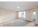 Comfortable bedroom with large window overlooking the backyard with neutral carpet at 5891 Mimosa Dr, Indianapolis, IN 46234