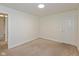 Bedroom features neutral carpet and a white door at 5891 Mimosa Dr, Indianapolis, IN 46234