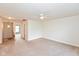 Large bonus room with neutral carpet, a ceiling fan and ample natural light at 5891 Mimosa Dr, Indianapolis, IN 46234