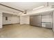 Spacious garage with epoxy flooring and plenty of storage cabinets at 5891 Mimosa Dr, Indianapolis, IN 46234