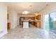 Spacious kitchen with stainless steel appliances, central island, and a sliding glass door to the yard at 5891 Mimosa Dr, Indianapolis, IN 46234
