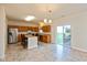 Bright kitchen with a stainless steel refrigerator, center island, and access to the backyard at 5891 Mimosa Dr, Indianapolis, IN 46234