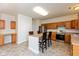 Eat-in kitchen with stainless steel appliances, central island, and plenty of cabinet space at 5891 Mimosa Dr, Indianapolis, IN 46234