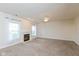 Spacious living room featuring new carpet, a fireplace, and natural light from large windows at 5891 Mimosa Dr, Indianapolis, IN 46234