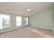 Large main bedroom suite features three windows, soft carpet, and a ceiling fan at 5891 Mimosa Dr, Indianapolis, IN 46234