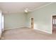 Large main bedroom with a ceiling fan and ensuite bath offers plenty of space at 5891 Mimosa Dr, Indianapolis, IN 46234