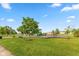 Community playground with mature trees, benches, and modern play equipment at 5891 Mimosa Dr, Indianapolis, IN 46234