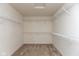 Walk-in closet with carpet features metal shelving for storage at 5891 Mimosa Dr, Indianapolis, IN 46234