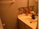 Well-lit bathroom featuring a modern vanity with stylish fixtures and mosaic tile at 6056 Blackley Ct, Indianapolis, IN 46254