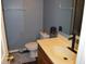 Cozy bathroom featuring a classic vanity, toilet, and neutral color scheme at 6056 Blackley Ct, Indianapolis, IN 46254